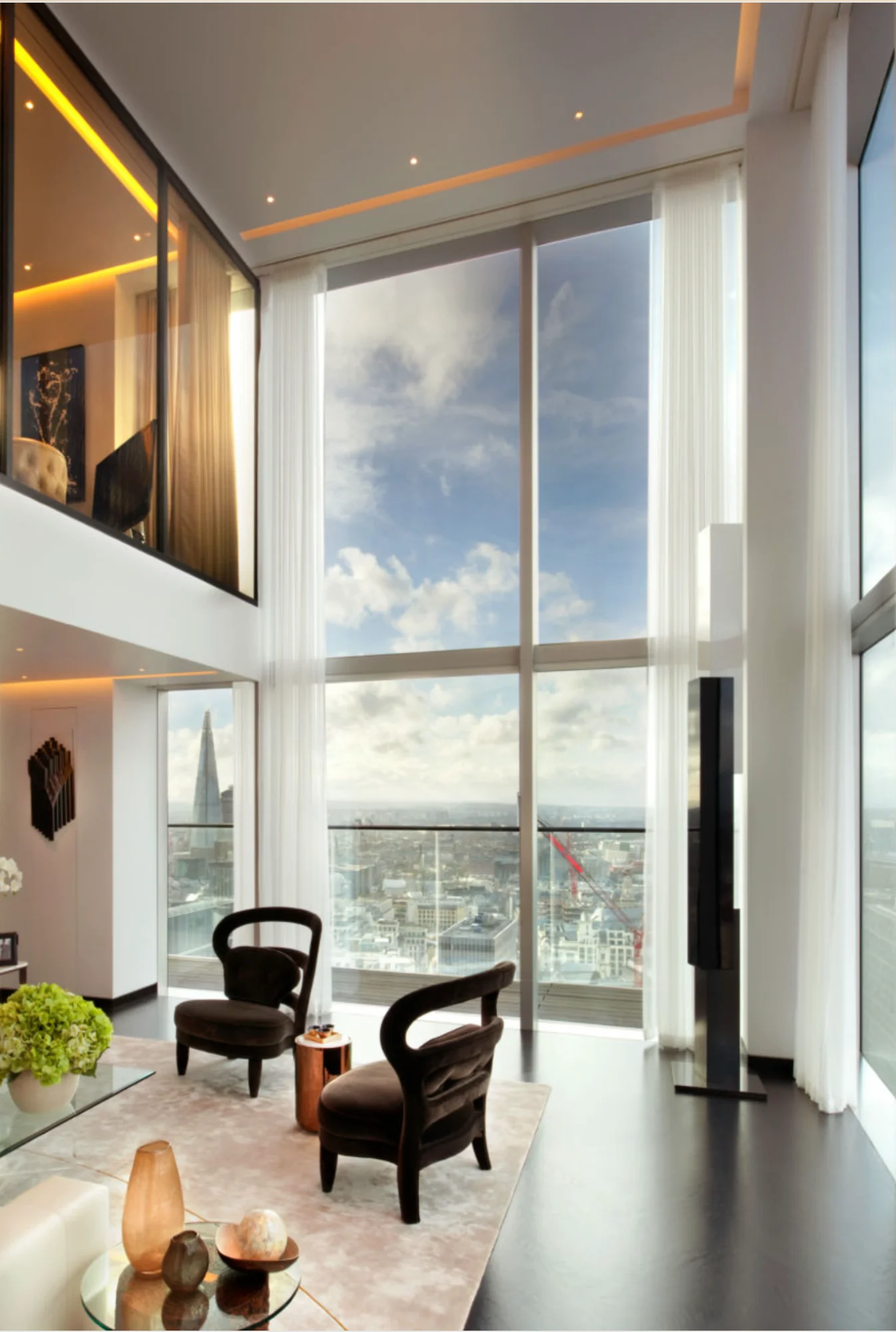 Luxury penthouse interior with floor-to-ceiling curtains and London skyline views